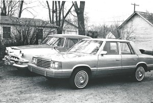 The 1981 Dodge Aries parked beside a 1956 Dodge Royal four-door. (Bud Wells photo)