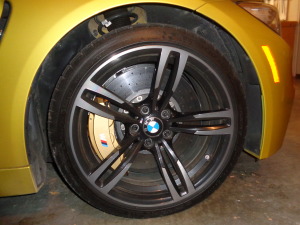 Wheels sport gold brake calipers and large rotors.