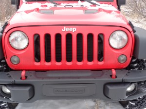 Jeep bumper shows removable end wings.