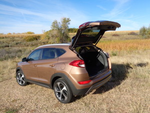 Liftgate on new Hyundai Tucson raises high to reveal roomier cargo area.