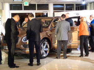 Dozens of eventgoers climbed in and out and around the new Bentley Bentayga.