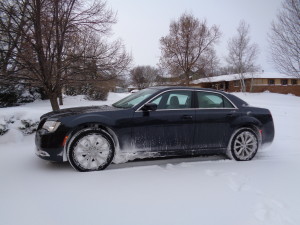 The Chrysler 300 AWD back in its driveway, already cleared of snow, after icy outing. (Bud Wells photo)