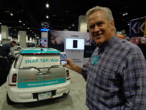 Rod Buscher displays use of Blinker app at Denver Auto Show. 