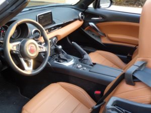 The Spider’s interior, trimmed in leather, is attractive and relatively comfortable.
