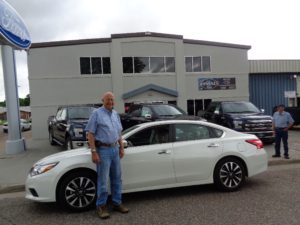 Car dealer/rancher Bob Bledsoe took a look at the new Nissan Altima at Wray. (Bud Wells photo)
